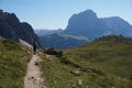 Hiking on trail on mastle alp in val gardena and awesome view to langkofel group