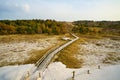 Hiking trail over a wooden footbridge to the high dune on the darss. National Park Royalty Free Stock Photo