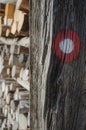 Hiking trail red and white circular mark on old barn house Royalty Free Stock Photo