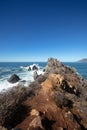 Waves breaking over rocks at Ragged Point at Big Sur on the Central Coast of California United States Royalty Free Stock Photo