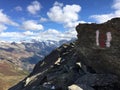 Hiking trail sign with mountain scenery