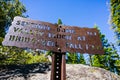 Hiking trail sign posted on the trail to Sentinel Dome, close to Glacier Point, showing points of interest and distances; Yosemite