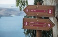 Hiking trail signs overlooking the Aegean Sea on Santorini Royalty Free Stock Photo