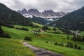 Hiking trail to St Magdalena church in Val di Funes valley, Dolomites, Italy. Furchetta and Sass Rigais mountain peaks Royalty Free Stock Photo