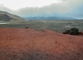 Hiking trail to Viti crater lake, red and black volcanic rock ground in Askja, Highlands of Iceland, Europe Royalty Free Stock Photo