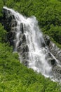 Waterfall Cascading from Mountain peak spring snowmelt southeast Alaska valdez Royalty Free Stock Photo