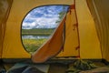 Hiking travel concept on summer vacation. View from tent - beautiful landscape of mountain nature
