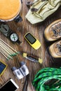 Hiking or travel equipment with boots, compass, binoculars, matches on wooden background. Active lifestyle concept Royalty Free Stock Photo