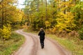 Hiking on a winding and colorful gravel road Royalty Free Stock Photo