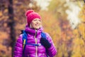 Hiking woman with backpack looking at camera in inspirational au Royalty Free Stock Photo