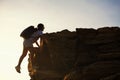 hiking woman climb to top hill at sunset Royalty Free Stock Photo