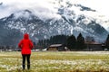 Hiking young woman with alps mountains and alpine on background. Travel Germany, Europe.