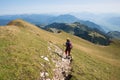 Hiking young woman at the mountain ridge trail, Rofan mountains austria Royalty Free Stock Photo