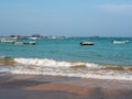 Hikkaduwa, Sri Lanka - March 4, 2022: Beautiful view of the beach in Hikkaduwa. People swim in the Indian Ocean near the boats. Royalty Free Stock Photo