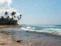 Hikkaduwa, Sri Lanka - March 8, 2022: Beautiful view of the coral reef of Hikkaduwa beach in the Indian Ocean. Copy space Royalty Free Stock Photo