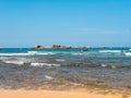 Hikkaduwa, Sri Lanka - March 8, 2022: People swim in the azure water of the Indian Ocean near the coral reef of Hikkaduwa beach. Royalty Free Stock Photo