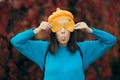 Hilarious Girl with Tongue Out Holding Autumn Leaves Royalty Free Stock Photo