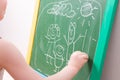 hild draws with chalk on a green blackboard family, happy family Royalty Free Stock Photo