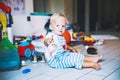 ÃÂ¡hild plays with soft toys at home.