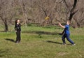 Happy children plays in frisbee outdoors keeping safety social distancing rules Royalty Free Stock Photo