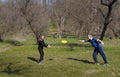 Happy children plays in frisbee outdoors keeping safety social distancing rules Royalty Free Stock Photo