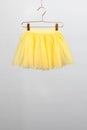 hildren skirt yellow hanger on gray background