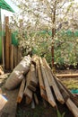 Hill of boards and white sacks in the garden.