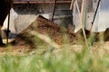 A hill of clean cly. We must take off stones and some mess. We see hill through grass. sifting of clay Royalty Free Stock Photo