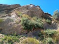 Hill with cliff, layers of clay and soil Royalty Free Stock Photo