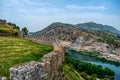 A hill on the coast of the Buna River - view from the observation deck of Rozafa Castle Shkoder, Albania. Ancient stone wall Royalty Free Stock Photo