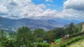 Hill and green trees under thick clouds somewhere in Letefoho, Timor-Leste. Royalty Free Stock Photo