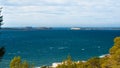 Hill side view from St Antoni de Portmany, Ibiza, into balearic sea on a clearing day in November, famous distant Conejera islands Royalty Free Stock Photo