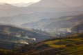 Hill slopes around small village. Spring landscape. Morning scenery Royalty Free Stock Photo