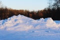 hill of snow removed from the road in the park Royalty Free Stock Photo
