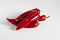 Hill of sweet paprika peppers on a white background. Chilli