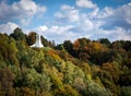 The hill of Three Crosses memorial in Vilnius, Lithuania. Colorful autumnal forest foliage. Royalty Free Stock Photo