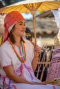 Hill tribe girl holding red paper umbrella in parade Royalty Free Stock Photo