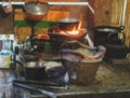 The hill tribe`s kitchen is old and doesn`t have any electrical appliances or technology.