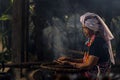 Hill tribe women sorting coffee beans. Old Woman selecting roasted coffee bean. Thailand