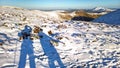 Hill Walkers in Winter Snow in England