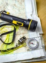 A hill walking map with compass torch and whistle. Royalty Free Stock Photo