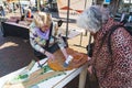 04.18.2023 Hillegom, Netherlands. Two Dutch women taking part in recycled art workshop. Elderly lady dressed in