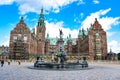 Tourists near sea god Neptune Fountain in Frederiksborg Castle. Hillerod, Denmark Royalty Free Stock Photo