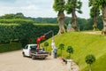 Hillerod, Denmark - 21 June 2023: View of Frederiksborg castle park. Loading sculpture onto a truck Royalty Free Stock Photo