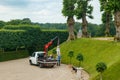 Hillerod, Denmark - 21 June 2023: View of Frederiksborg castle park. Loading sculpture onto a truck Royalty Free Stock Photo