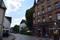 Hillesheim, Germany - 06 15 2023: Old town Street with a Hotel dedicated to Crime Fiction Story Fans