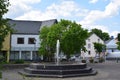 Hillesheim, Germany - 06 15 2023: Central Place with a Fountain