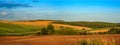 hills are agricultural land, plowed land and a wheat field Royalty Free Stock Photo