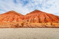 Hills of ancient multi-colored sediments, red yellow and white clay