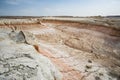 Hills of chalk and limestone and slopes of multi-colored mountains with weathering and washouts from water Royalty Free Stock Photo